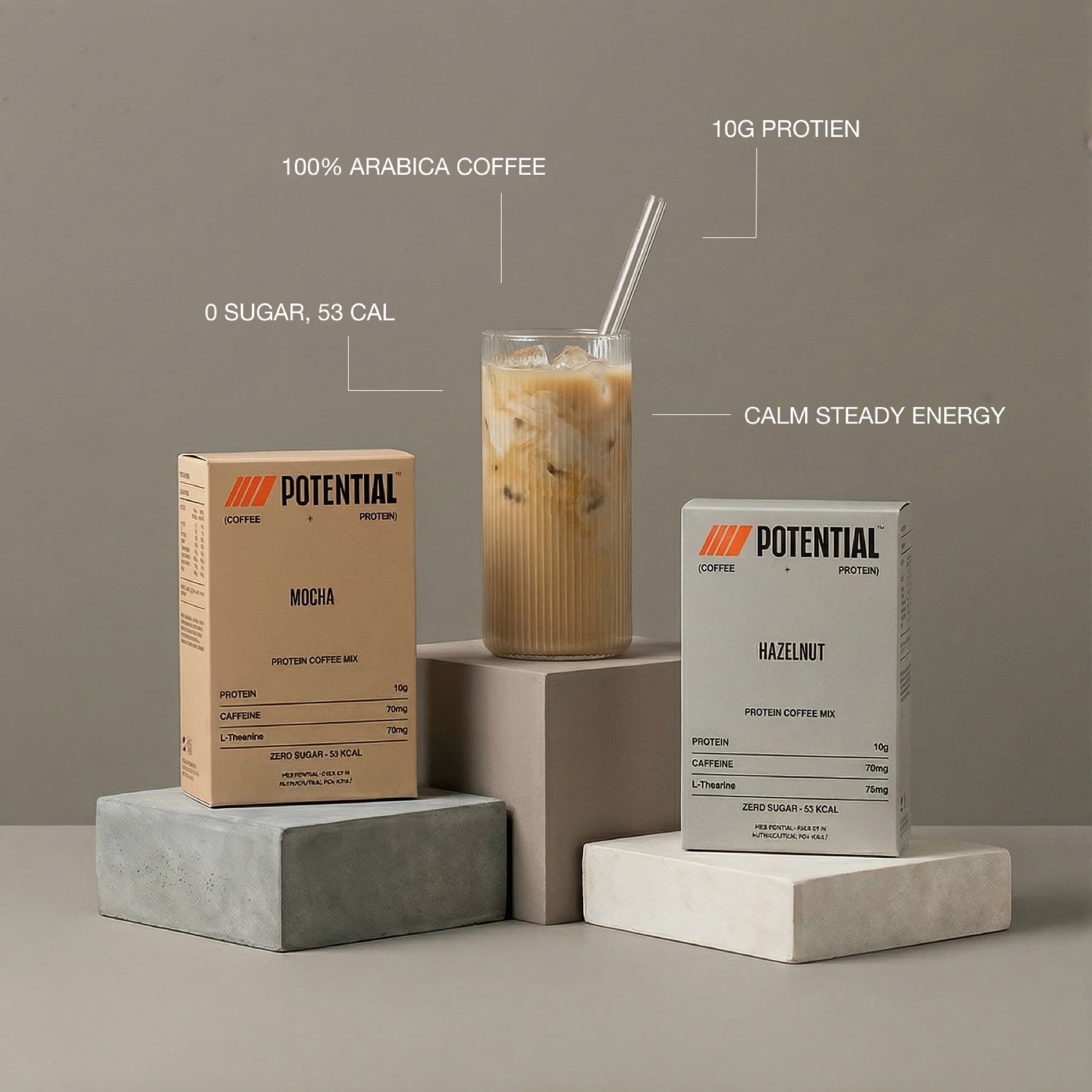 Studio hero — iced glasses and boxes on stone pedestals with ingredient callouts